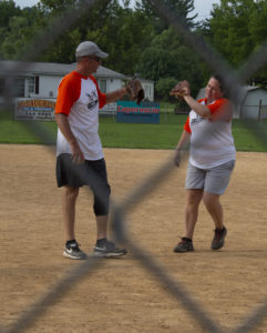 NPC's Sonny & Stephanie high-five on softball field